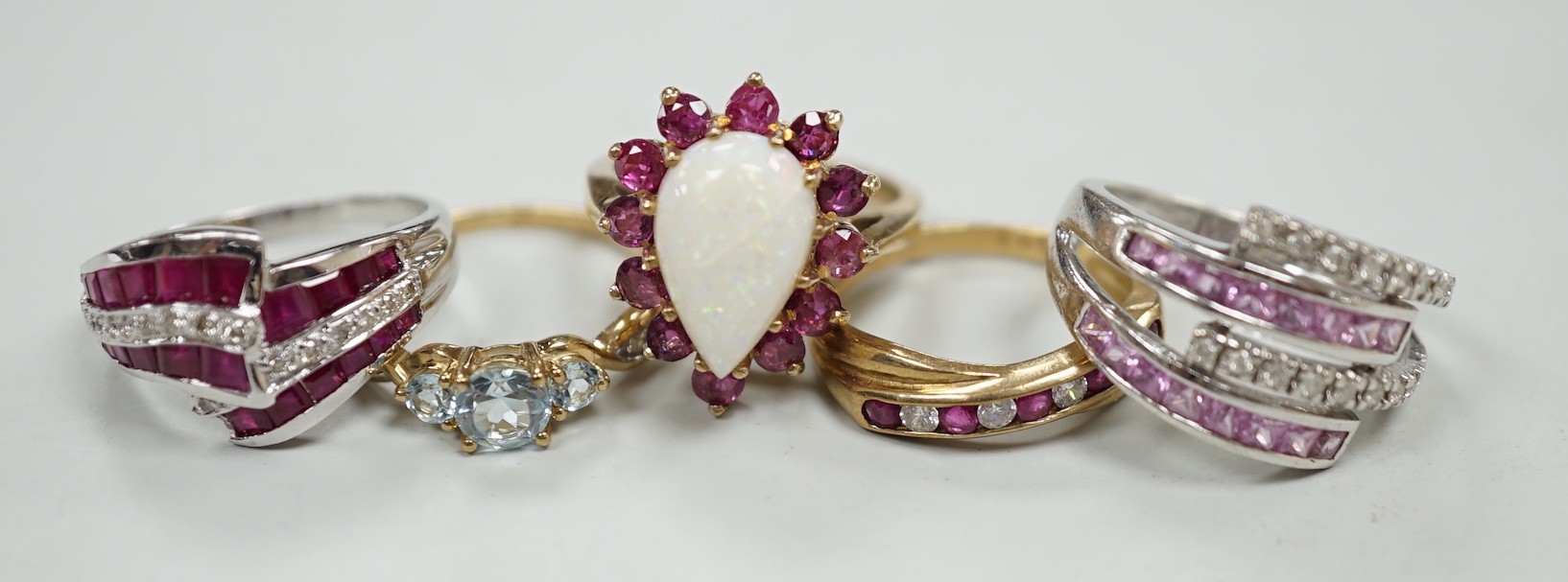 Five assorted modern 9ct gold and gem set dress rings, including ruby and diamond chip, gross weight 16.8 grams.